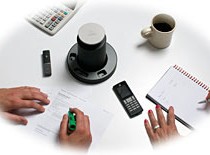 Revolabs FLX 2 on table top with two microphones
