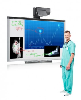 SMART board showing xrays and medical information with doctor stood in front